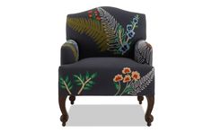 an upholstered chair with floral designs on the armrests and foot rest