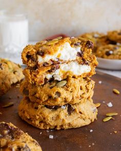 three cookies stacked on top of each other with chocolate chips and marshmallows