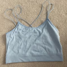 Size Small, Baby Blue With Sparkles Tank Top With Cross Cross Detail On The Back. The Sparkles Are More Apparent In Person. Size Small, Super Comfortable But I’ve Never Worn It, Perfect Condition. From Hollister Spring Light Blue Tank Top With Built-in Bra, Light Blue Tank Top With Built-in Bra For Spring, Light Blue Spring Tops With Built-in Bra, Light Blue Tops With Built-in Bra For Spring, Light Blue Seamless Tank Top For Spring, Spring Blue Workout Tops, Blue Workout Tops For Spring, Light Blue Summer Top With Built-in Bra, Light Blue Seamless Sleeveless Crop Top