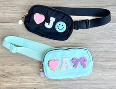 This personalized handbag for kids features a charming coquette bow, perfect for girls. It is a custom waist bag with patches, making it an ideal birthday gift. Our custom hip pack for girls adds a stylish and practical touch to any outfit. 💜BAG DETAILS: -waterproof  -toddlers/young children can wear them crossbody  -teens/adults wear as a waist bag/crossbody bag/chest bag/bum bag -two pockets (main pocket and back pocket) -add an adorable happy face bag charm (comes in random color) -size/shap Cute Personalized Black Bag, Personalized Playful Blue Bag, Playful Personalized Blue Bag, Cute Personalized Bags For School Events, Customizable Cute Bags For School Events, Patch Bag, Hip Pack, Bow Bag, Coquette Bow