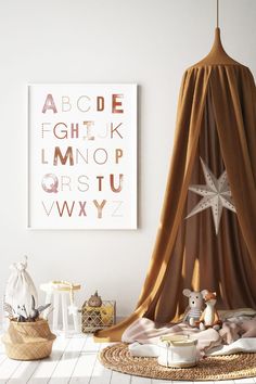 a baby's room with a poster on the wall and a teddy bear in bed