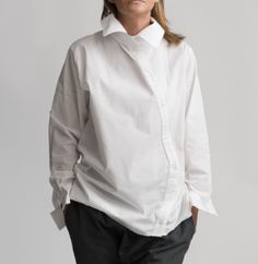 White tunic blouse with collar, Asymmetrical buttons, and asymmetrical elongated back. Traditional style with a unique accent.    The shirt is a trendy-looking style for your office, daily wear, or special event. High-quality product  You can wear it all year to pair with jeans, skinny pants, or shorts.         Color - White - Black   Season - All seaons  Material - 100% Cotton  Package included: 1 Shirt look at other similar items in my Etsy shop: https://www.etsy.com/shop/RenatteShop  Size Cha White Tunic Blouse, Blouse With Collar, Casual Shirt Women, Maxi Shirts, Loose Shirt, White Tunic, Loose Shirts, Collar Blouse, Tunic Blouse