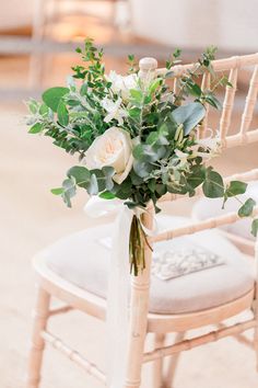 a bouquet of flowers is sitting on a chair