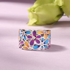 Let the ring embrace your finger like a wreath. This beautifully detailed ring boasts charming flowers in bright shades of multicolored enamel. The intricate flawless enamel work coupled with white stones, make this an eye-catching piece. Inspired by the serene beauty of nature, this ring will brighten up even the dullest of days in your life. It is a minimal ring that brings you a blooming mood.Carat Weight: 0.825 ctStone Size: 1.5 mmStone Type: Jeulia® StoneNumber of Stones: 11 Stone Shape: Ro Flower-shaped Enamel Ring For Gift, Floral Enamel Ring As Gift, Flower Shaped Enamel Ring For Gift, Flower Shaped Enamel Ring As A Gift, Flower-shaped Enamel Ring As Gift, Enamel Jewelry For Spring Gifts, Spring Enamel Jewelry For Gifts, Spring Enamel Jewelry As Gift, Spring Gift Enamel Jewelry