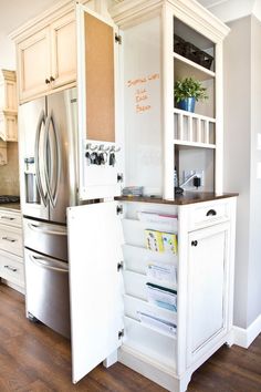 a refrigerator freezer sitting inside of a kitchen