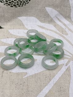 small green rings sitting on top of a table