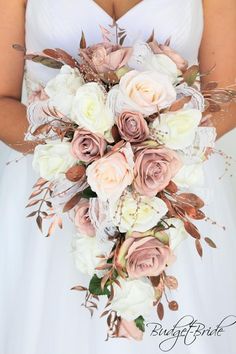 a bridal bouquet with white and pink flowers