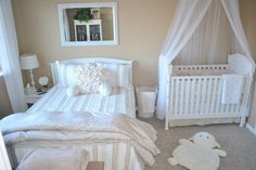 a baby's room with a crib, bed and stuffed animals on the floor