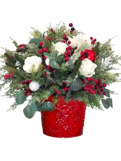 a red vase filled with white flowers and greenery