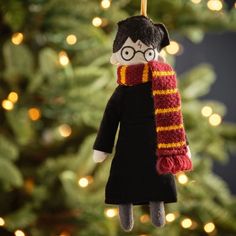 a harry potter ornament hanging from a christmas tree