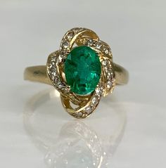 vintage emerald ring, emerald jewelry, emerald ring vintage, emerald gold ring, emerald diamond ring, 14k emerald ring, 14k vintage ring A distinctive vintage emerald ring featuring an oval cut center stone weighing 1.28 carats accented by 0.73 carats of diamonds set in a solid 14k gold. *Ring size: US 7 1/4 *Ring weight: 4.29 Grams *Center stone dimensions: 8X6mm Antique Green Oval Diamond Ring, Vintage Emerald Diamond Ring In Green, Vintage Emerald Ring With Diamond For May Birthstone, Vintage Diamond Emerald Ring For May Birthstone, Art Deco Green Emerald Ring In 14k Gold, Art Deco Emerald Ring In 14k Gold, Vintage Green Emerald Diamond Ring, Antique Emerald Cut Green Emerald Ring, Antique Green Emerald Cut Ring