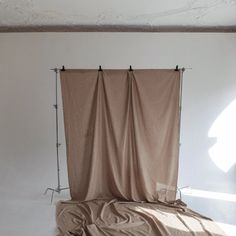 an empty room with a curtain in the middle