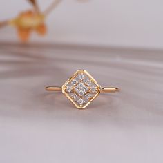 a diamond ring sitting on top of a table