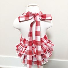 This red and white buffalo plaid baby romper is made from a lightweight fabric, perfect for hot summer days! It features three rows of full, fluffy ruffles and a halter tie. Slides on quickly and the long straps tie into a cute bow. Ready to ship. Only 2 left! As always, quality matters at Necessary Cuteness. All fabrics are prewashed and dried prior to construction to minimize shrinkage. Exposed seams are either finished with French seams or serged. Ruffles are serged and gathered using a vinta Cow Outfits, Plaid Baby, Baby Bubble, Ruffle Romper, Baby Girl Romper, White Buffalo, French Seam, Girls Rompers, Cute Bows