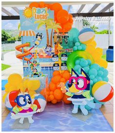 an assortment of balloons and decorations for a cartoon themed birthday party at a pool bar