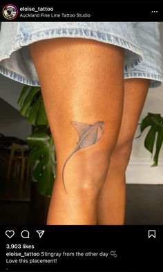 a woman's leg with a tattoo on it