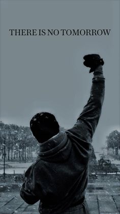 a man raising his arms in the air with an inspirational quote above it that reads, there is no tomorrow