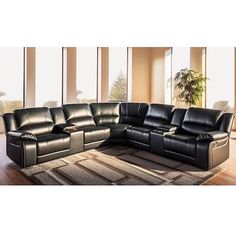 a black leather sectional sofa sitting on top of a rug in front of large windows