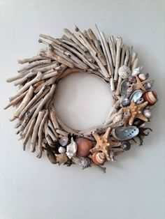 a wreath made out of driftwood and shells