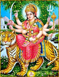 the hindu goddess sitting on top of a tiger