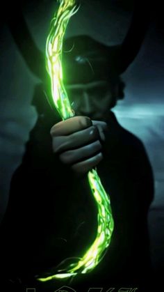 a person holding a glowing green light in their hand with the caption's name on it