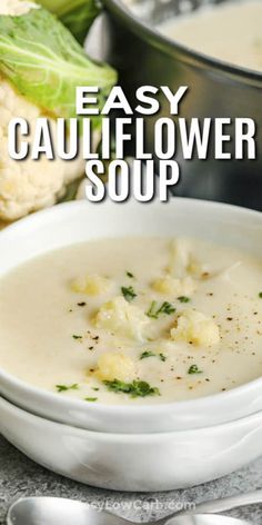 a white bowl filled with cauliflower soup next to some vegetables