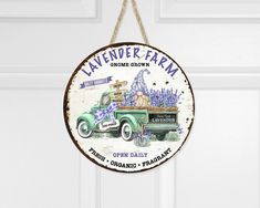 a sign hanging from the side of a door that says lavener farm on it