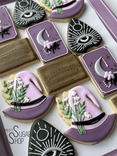 decorated cookies in the shape of hats and flowers