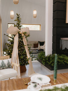 a living room with a christmas tree in the corner