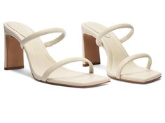 Schutz Ully Tab - Women's Sandals : Pearl : Step into the realm of timeless grace wearing the Schutz Ully Tab, a high-heeled leather sandal that seamlessly blends elegance and ease. Crafted with cushioned straps and a foam insole, this sandal provides unparalleled support for your every step. Made from premium leather, including the upper, lining, and outsole, it offers durability and style in one exquisite package. Slip-on style. Made in Brazil. Measurements: Heel Height: 4 in Weight: 6.6 oz Pr Elegant Mules With Stacked Heel And Single Toe Strap, Elegant Mules With Reinforced Heel And Single Toe Strap, Elegant Summer Sandals With Toe Loop, Elegant Summer Toe Loop Sandals, Elegant Block Heel Mules With Heel Loop, Summer Leather Toe Loop Heels, Chic Sandals With Heel Strap And Toe Loop, Elegant Toe Loop Heels For Spring, Spring Formal Toe Loop Heels