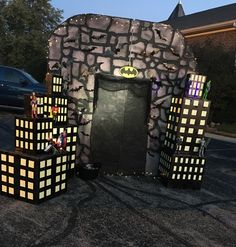 a batman themed display in the middle of a parking lot