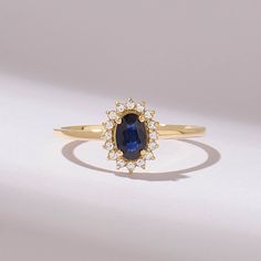 an oval shaped blue sapphire and diamond ring