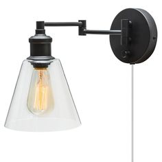 an industrial style wall light with clear glass shade and black metal arm, on a white background