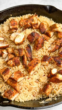 chicken and rice in a skillet ready to be eaten