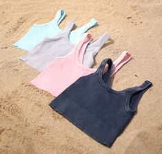 A new and reversible ribbed crop top that is must be a part of your basics collection! The fabric is soft and stretchy and can be worn as a scoop neck or v-neck. Offered in a 4 different colors, these tanks are must have for your closet! Trust us when we say get all the colors! One size fits most Fabric: 92% Nylon, 8% Spandex Care Instructions: Hand wash We would love to see you with your new tote! Please tag us @thesaltyblonde.co on Instagram! No refunds or exchanges at this time. If you have a Ribbed Crop Top, Pastel Blue, Print Stickers, Crop Tank, All The Colors, Care Instructions, Scoop Neck, Crop Top, Hand Wash