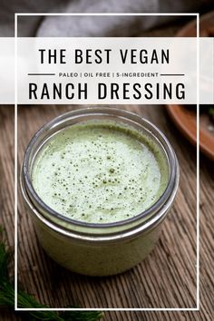 the best vegan ranch dressing in a mason jar on a wooden table with fresh herbs