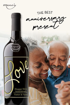 an older couple embracing each other with a bottle of wine in front of them and the words love written on it