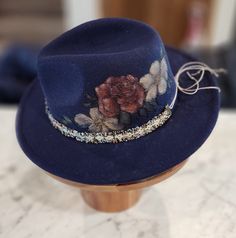 Felt/wool hat hand burned with floral pattern. Hand colored and hand made band. Adjustable and nice quality. beautiful navy blue color ... fun for any event, awesome Christmas gift! Blue Bohemian Hat For Gift, Blue Bohemian Hat As Gift, Unique Blue Festival Hats, Handmade Blue Fedora With Curved Brim, Handmade Blue Fedora With Flat Brim, Blue Handmade Hats For Kentucky Derby, Bohemian Winter Fedora For Party, Handmade Blue Fall Hats, Unique Adjustable Blue Hat