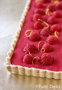 raspberry tart with orange zest on top