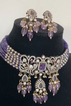 Peacock inspired Moissanite Necklace in purple beads with peacock pattern and earrings *Antique Finish *Premium Quality *Lab created Mossanite Necklace Type - Choker & has adjustable dori Earrings length 2 inches approximately and pushback. Purple Beaded Jewelry For Wedding, Purple Round Beads Jewelry For Festive Occasion, Purple Kundan Jewelry Gift, Purple Beaded Jewelry For Festive Occasions, Elegant Purple Meenakari Jewelry, Elegant Purple Jewelry For Festivals, Elegant Purple Jewelry Set For Festive Occasion, Purple Jewelry For Festivals And Celebrations, Festive Purple Chandbali Jewelry