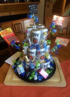 a birthday cake made out of cans and candy