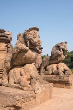 statues of lions on display in an outdoor setting