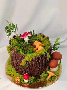 a cake made to look like a forest with mushrooms and other things on the top