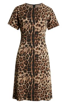 One of D&G's go-to patterns—iconic, retro leopard—is the allover jacquard patterning of this short-sleeve dress that's an example of the simple made stunning. Hidden back-zip closure Jewel neck Short sleeves 55% rayon, 42% nylon, 3% spandex Dry clean Made in Italy Designer Clothing Fitted Jacquard Dress With Short Sleeves, Chic Jacquard Short Sleeve Dress, Chic Short Sleeve Jacquard Dress, Fitted Short Sleeve Leopard Print Dress, Fitted Leopard Print Dress For Formal Occasions, Formal Fitted Leopard Print Dress, Dolce Gabbana Dress, Jacquard Pattern, Jacquard Dress