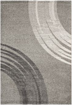 a gray rug with wavy lines on it