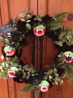 a wreath that has been made to look like a monster with its mouth wide open