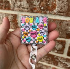 This encouraging badge reel is made of acrylic and can be wiped down for cleaning. You choose an alligator swivel clip, a belt clip, or topper only. "Topper only" means you are ordering only the acrylic piece with soft hook and loop fastener on the back. The cord extends approximately 34 inches. All my items come from a smoke-free and pet-free home. All items are shipped in boxes for added protection. Shipping overages will be refunded. Hook And Loop, Glitter, Valentines