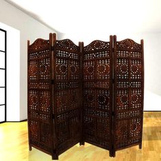 a room divider made out of wood with intricate carvings