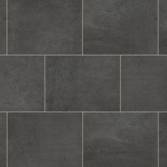 a black tile floor with grey grouting