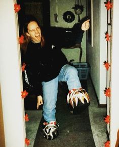 a man riding a skateboard down a hallway